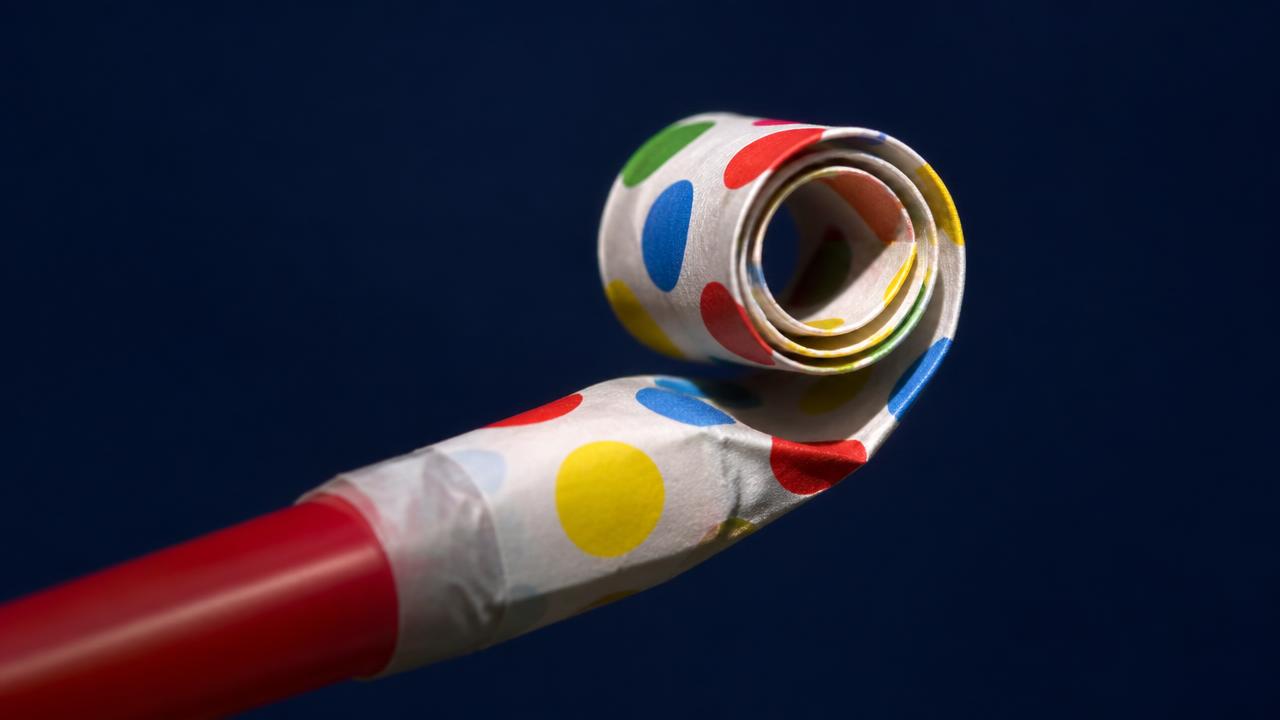 Close-up of a party blower uncurling, illustrating surprising and delighting customers at every opportunity.